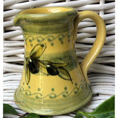 Provence Ceramic Creamer - Olives Light Yellow & Green
This hand made and hand painted ceramic creamer with an olives design will add a dash of Provence to your breakfast table. 

Height: 4"    

Product of France